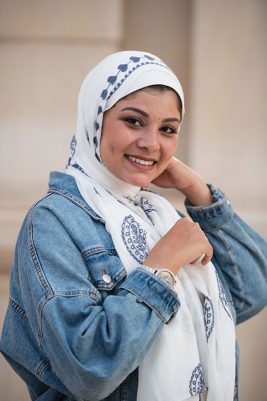 EMMA scarf Love Me White ,a white hijab with blue embroidery accents of pashmina and hearts.