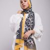 Hijabi model in EMMA SCraf aztec sunshine with yellow border, hand on her shoulder