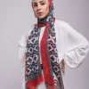 Hijabi model in EMMA Scarf Aztec Rouge with red border
