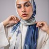 Hijabi Model in EMMA satin scarf Pareisienne Azure, with hues of blue, grey and gold
