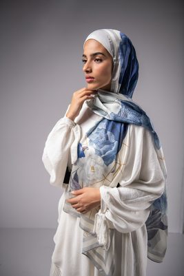 Hijabi Model in EMMA Satin Hijab Pareisienne Azure, with gold geometric lines,Roses in hues of blue and grey liines
