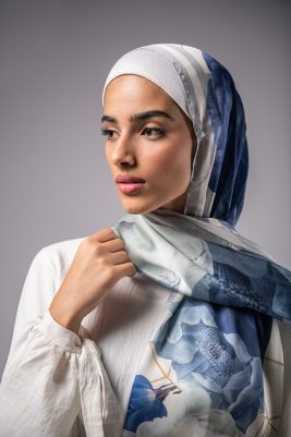 Hijabi Model in EMMA Satin Hijab Pareisienne Azure, with gold geometric lines,Roses in hues of blue and grey liines