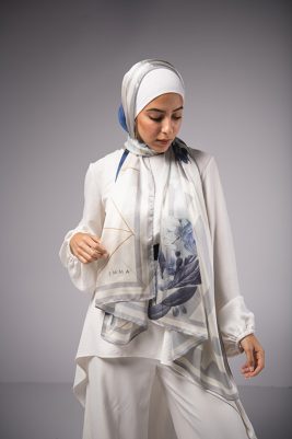 Hijabi Model in EMMA Satin Hijab Pareisienne Azure, with gold geometric lines,Roses in hues of blue and grey liines