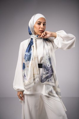 Hijabi Model in EMMA Satin Hijab Pareisienne Azure, with gold geometric lines,Roses in hues of blue and grey liines