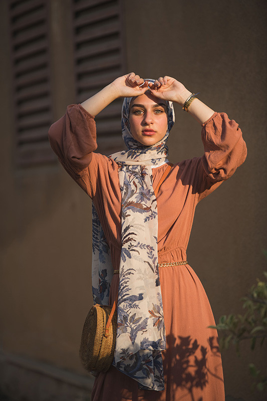 hijabi model in her EMMA Scarf Camel Denim staring at camera , hands on her forehead